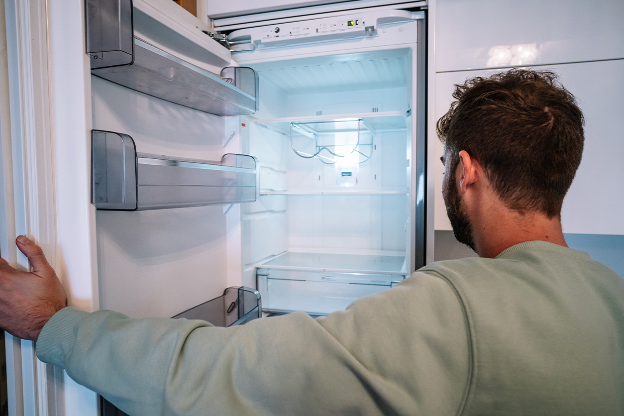 Man checking his fridge