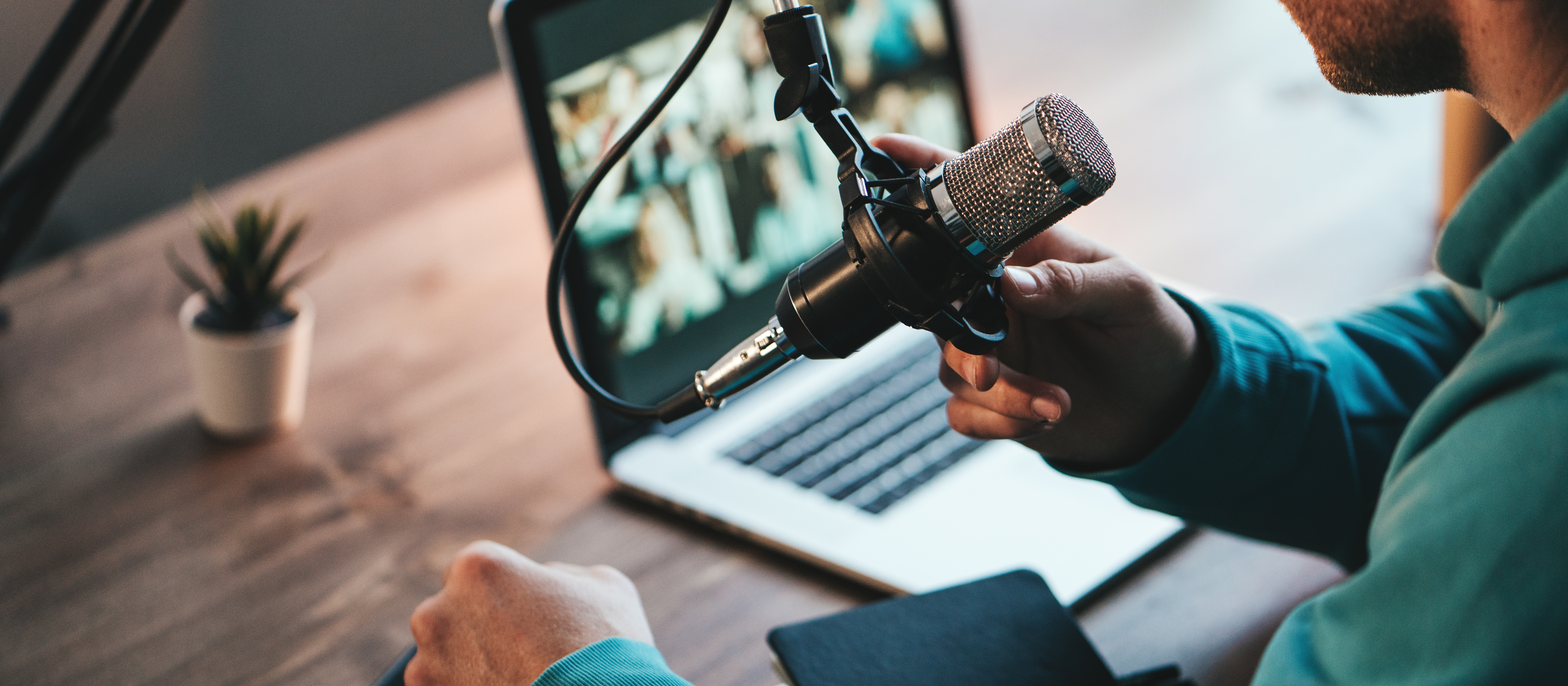 Man recording podcast on microphone